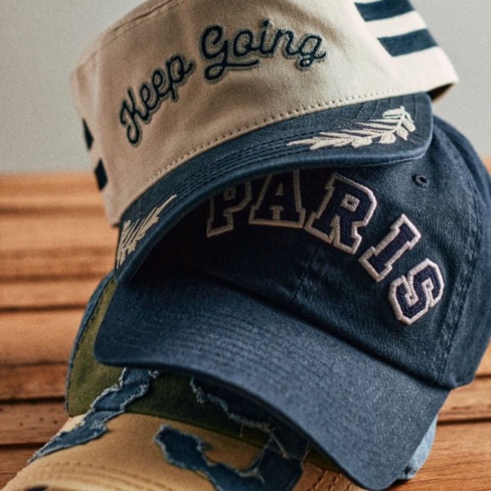 FREE PEOPLE KEEP GOING TRUCKER HAT